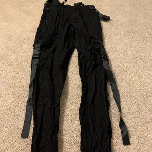 Black harem pants w buckles.